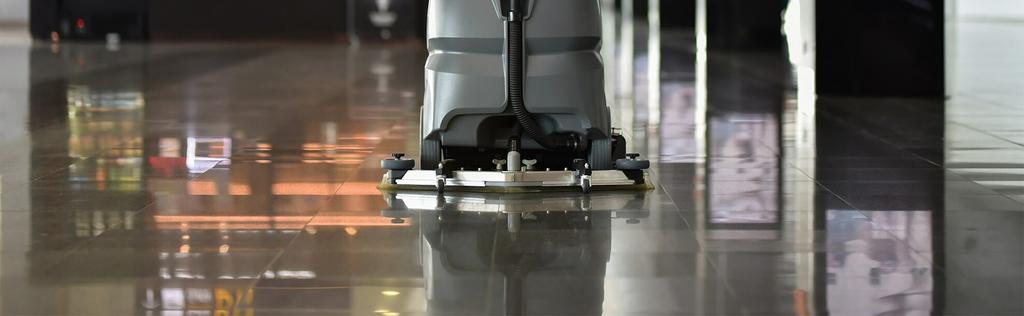Shiny smooth floor with a cleaner running on it